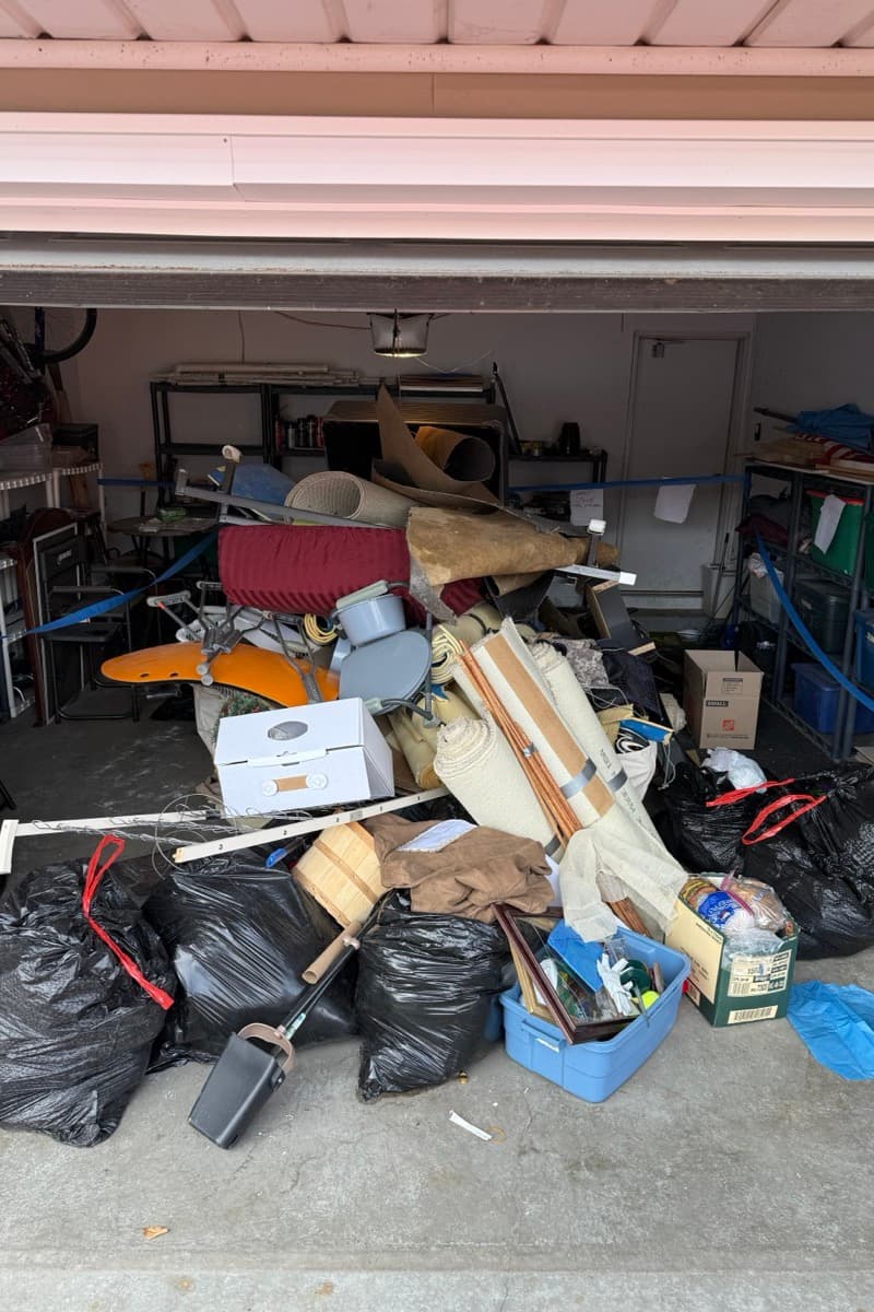 Garage cleanout — cluttered garage ready for junk removal